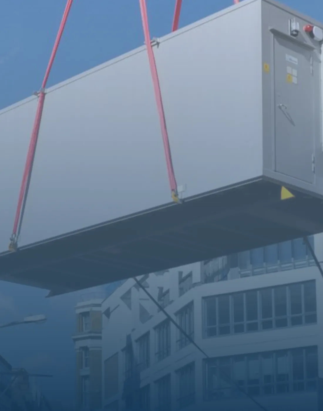 A relocatable equipment building lifted by crane