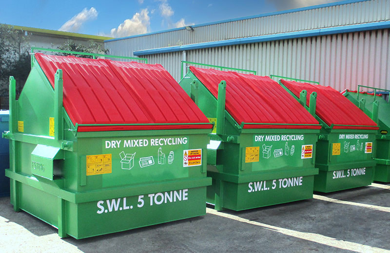 Green dry mixed recycling containers with red lids